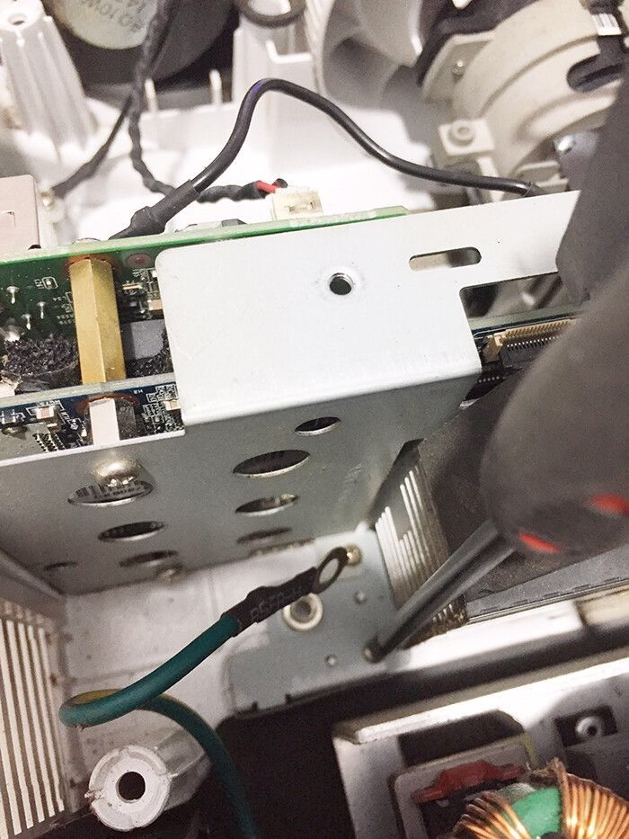 man removing the power supply optoma projector